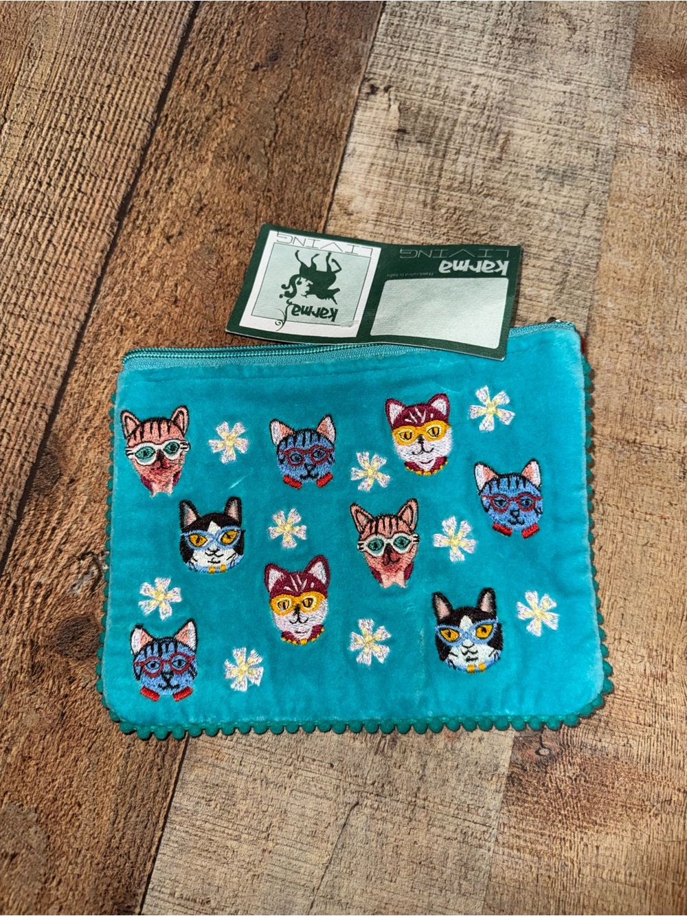 Karma living cat face Pom Pom pouch new with flaws